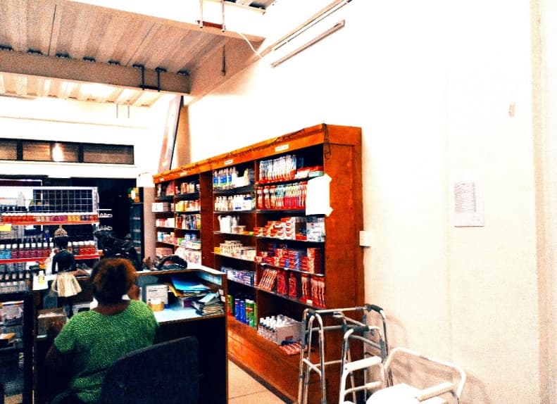 The counter and shelves inside Family Care Pharmacy